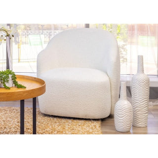 Ibiza Swirl Bouclé Swivel Armchair in living room