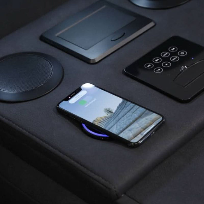the convenience of a wireless charger, USB charger, and A/C socket ensures all your devices stay powered up without leaving the comfort of your seat.