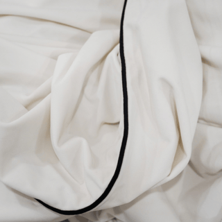 White and Black Double Sided Piping Throw Close-up
