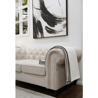 White and Black Double Sided Piping Throw on Sofa