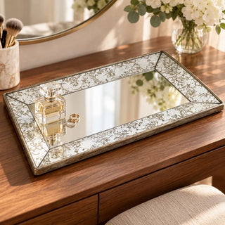 Antique style dual purpose tray mirror on walnut vanity with perfume and gold rings