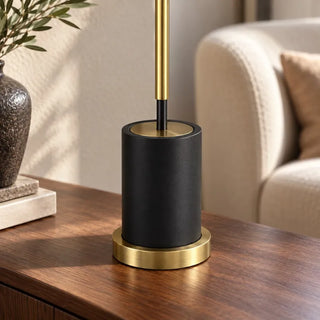 Bella tall table lamp close up of black cylinder base with brass ring foot