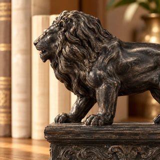 Black lion bookends close up of roaring head mane and scroll relief plinth