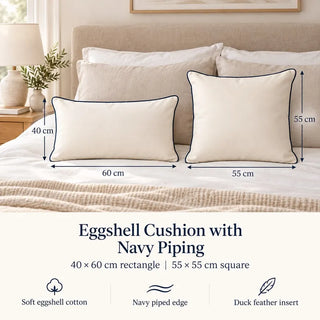 Eggshell cushion with navy piping size guide 40cm x 60cm and 55cm x 55cm on bed