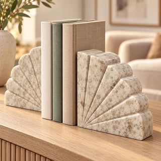 Fan shaped marble bookend set on fluted oak sideboard with olive branch vase