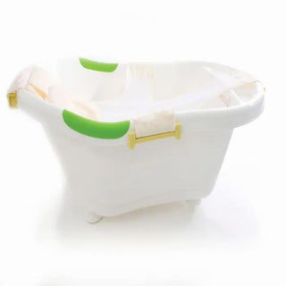 White plastic baby bathtub with green handles and a mesh infant support sling