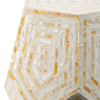 Close-up of geometric mosaic accent table with yellow and white stone tile pattern