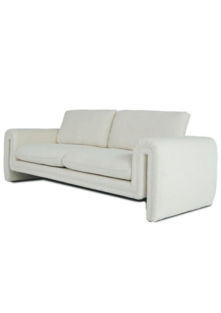 Modern white fabric sofa with plush cushions and geometric armrests, minimalist design