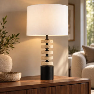 Kent marble lamp and shade lit on walnut sideboard with stone bowl and olive branches