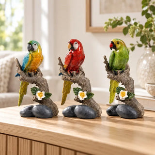 Macaw on branch bird set of 3 on oak sideboard beside ceramic vase with greenery