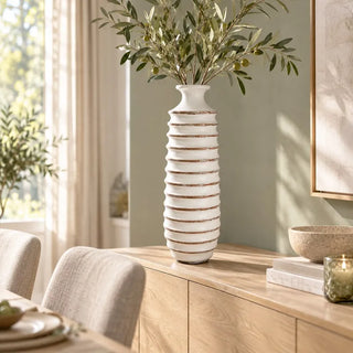 Medi resin ring vase with olive branches on oak sideboard beside dining chairs