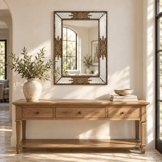 Milan rectangular golden mirror above oak console table in arched entryway