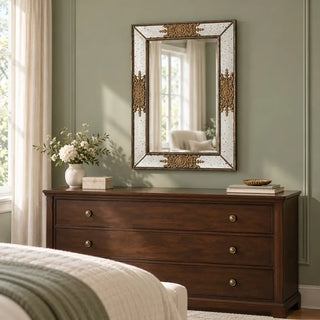 Milan rectangular golden mirror above walnut dresser in sage green bedroom