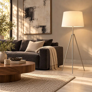 Milan silver floor lamp in living room beside charcoal sofa and walnut coffee table