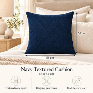 Navy textured cushion size guide 55cm x 55cm on cream bed