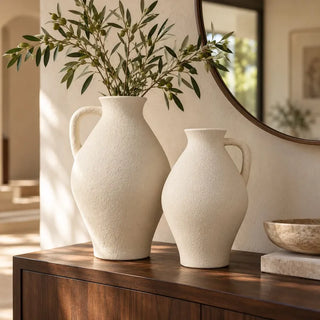 Sandroot vase with handle pair on dark timber sideboard beneath round mirror