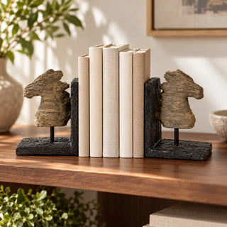 Shadow horse head bookend sculpture pair with cream linen books on walnut shelf