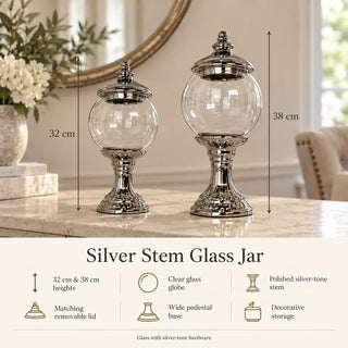 Silver stem glass jar 32cm and 38cm heights and feature icons on marble console
