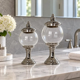 Silver stem glass jar 32cm and 38cm on marble bathroom vanity beside white hydrangeas
