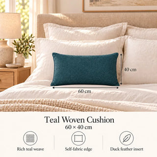 Teal woven cushion size guide 40cm x 60cm on cream bed