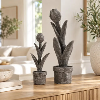 Tulip flower sculpture small and tall on oak sideboard beside olive branch vase