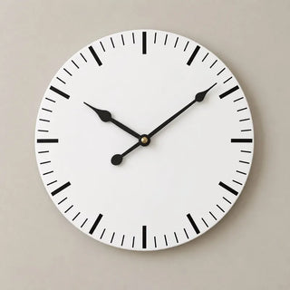 White mdf classic wall clock front view with black baton markers on beige wall

