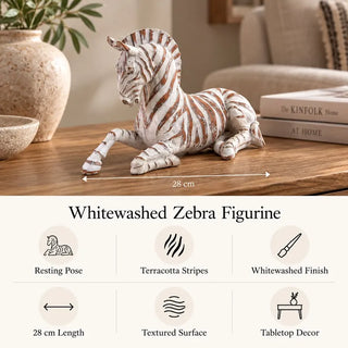 Whitewashed zebra figurine 28cm length and feature icons on wooden coffee table