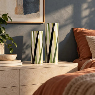 Zen ceramic vase pair on beige bedside drawers beside terracotta bedding