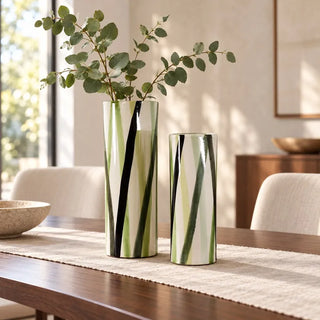 Zen ceramic vase pair with eucalyptus on linen runner on walnut dining table