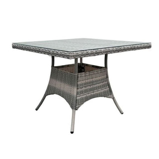 Close-up of the Serenity Wicker Oasis table's tempered glass top